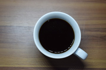 A Cup Of Coffee at Wooden Table Texture