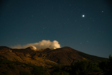 Fototapeta na wymiar Active volcano under star sylius