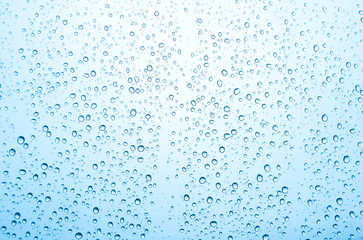 Naklejka na ściany i meble Water drops on glass or rain drop