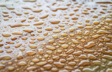 Rain or water drops on wood background 