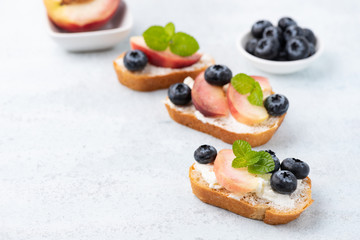bread toast with peach and blue berry