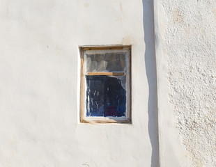 Fototapeta na wymiar windows on an old abandoned house