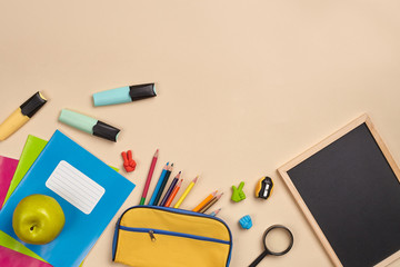 Flat lay photo of workspace desk with school accessories or office supplies.