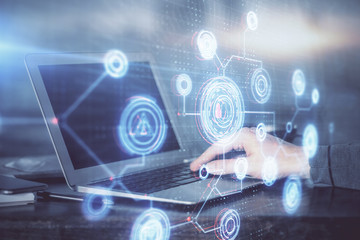 A man working on Laptop with technology theme drawing. Concept of big data. Double exposure.