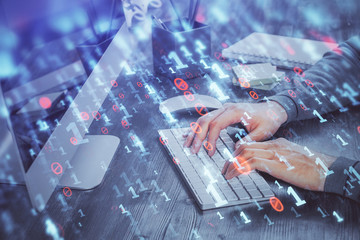 Double exposure of tech drawings with hands working on computer background. Concept of innovation.