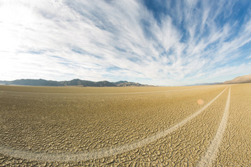 Tire tracks running across the black rock desert playa