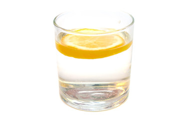 Glass of pure water with lemon isolated on a white background