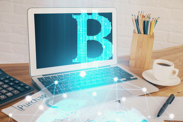Double exposure of blockchain and crypto economy theme hologram and table with computer background....