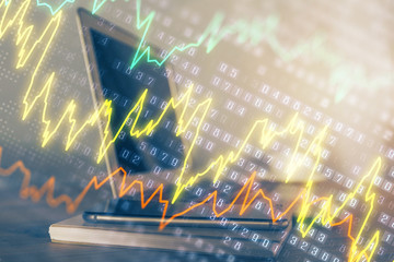 Forex market graph hologram and personal computer on background. Multi exposure. Concept of...