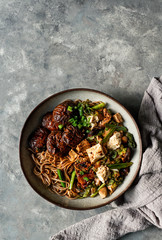 asian vegan soba noodle  with tofu cheese,shiitake mushroms, top view, copy space