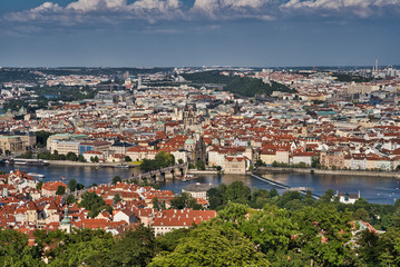 Fototapeta na wymiar view of Prague old town, Charles bridge, St Vitus Cathedral and red roofs