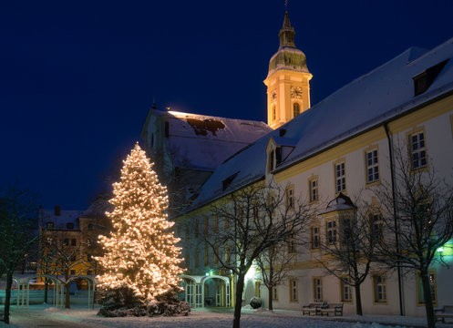 Christmas tree in front of church, blue hour