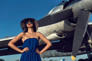 Brunette in a dress at the old airport