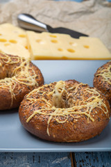 Tasty baked bagels with melted french emmental cheese