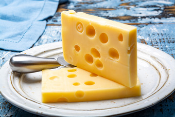 Two blocks of French emmental semi-hard cheese
