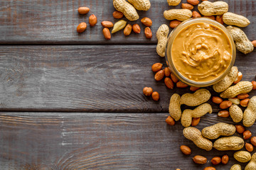 peanut butter for cooking breakfast at home on wooden background top view mock up