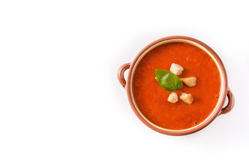 Tomato soup in brown bowl isolated on white background. Top view. Copyspace