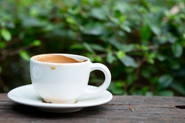 Empty hot coffee cup after drink on wood table