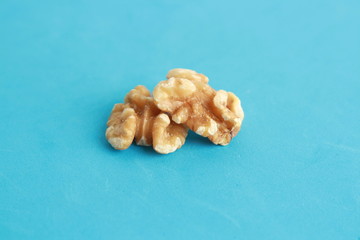 Peeled walnuts in colorful background