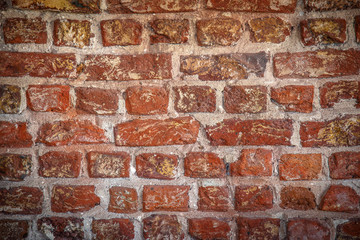 red brick wall texture grunge background with vignetted corners, may use to interior design