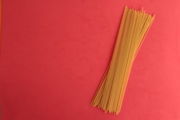 raw spaghetti pasta in colorful background