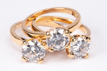 Close up of clear stone gold rings