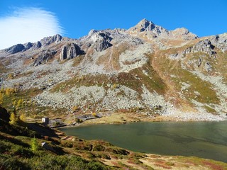 Fototapeta na wymiar A classic alpine lake immersed in the Nature of the Natural Park 
