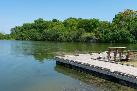 Small Dock with a Bench on a Water Filled Quarry in Lemont Illinois