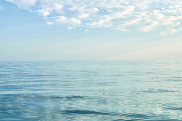 The calm water of the sea, ocean with blue sky. Summer seascape. Calmness, poise concept.