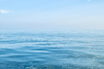 The calm water of the sea, ocean with blue sky. Summer seascape. Calmness, poise concept.