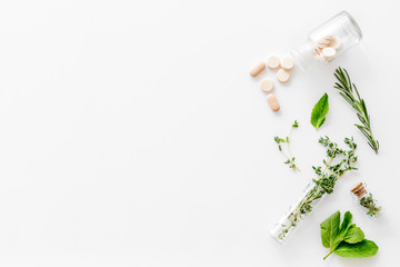 Store up medicinal herbs and pills on white background top view space for text