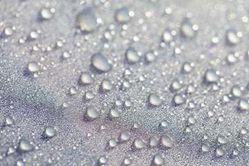 Background design made of water drops on a gray background