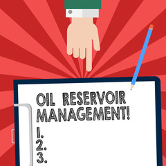 Handwriting text writing Oil Reservoir Management. Concept meaning analysisaging the recovery of natural gas from rock Hu analysis Hand Pointing Down to Clipboard with Blank Bond Paper and Pencil