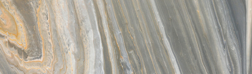 photography of abstract marbleized effect background. black, gray, gold and white creative colors. banner