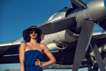 Brunette in a dress at the old airport