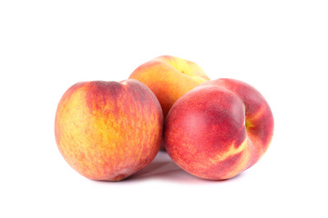 Fresh peaches isolated on white background