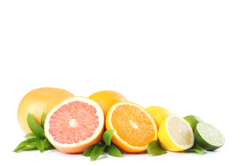 Citrus fruits with green leafs isolated on white background