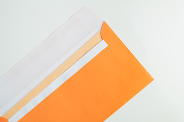 Open envelope in white background, top view. Abstract image of postal package, concept of communication and mailing