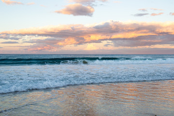 Fototapeta na wymiar Beautiful sunset with ocean and waves