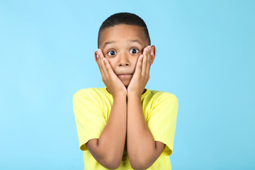 Cute american boy on blue background