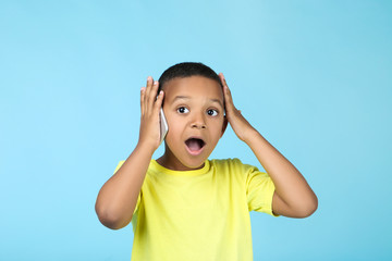 Cute american boy talking on mobile phone