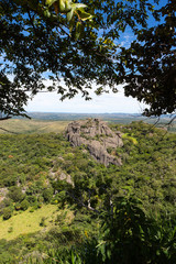 Beautiful aerial view of Serra do Cipo in Minas Gerais with forests and rock mountains in sunny summer day with blue sky. Landscape of the Brazilian Cerrado, one of the most devastated biomes.