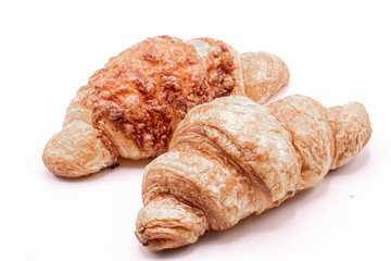 Fresh and tasty buttery croissants isolate on white background.