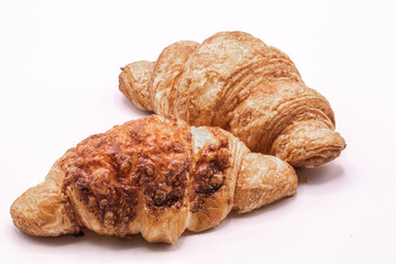 Fresh and tasty buttery croissants isolate on white background.