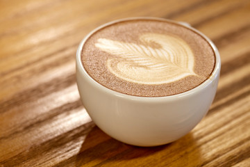 High Angle View Of Coffee On Wooden Table