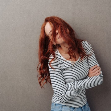 Young woman with her long hair over her face