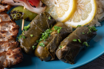 greek dolmades on blue plate