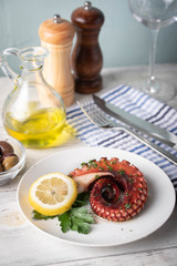 greek grilled octopus on white plate