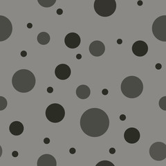 Randomized polka dot seamless pattern in chic color palette of gray and black. Great for textiles, stationery items, home decor and fashion uses. Modern take on a classic design. Vector.