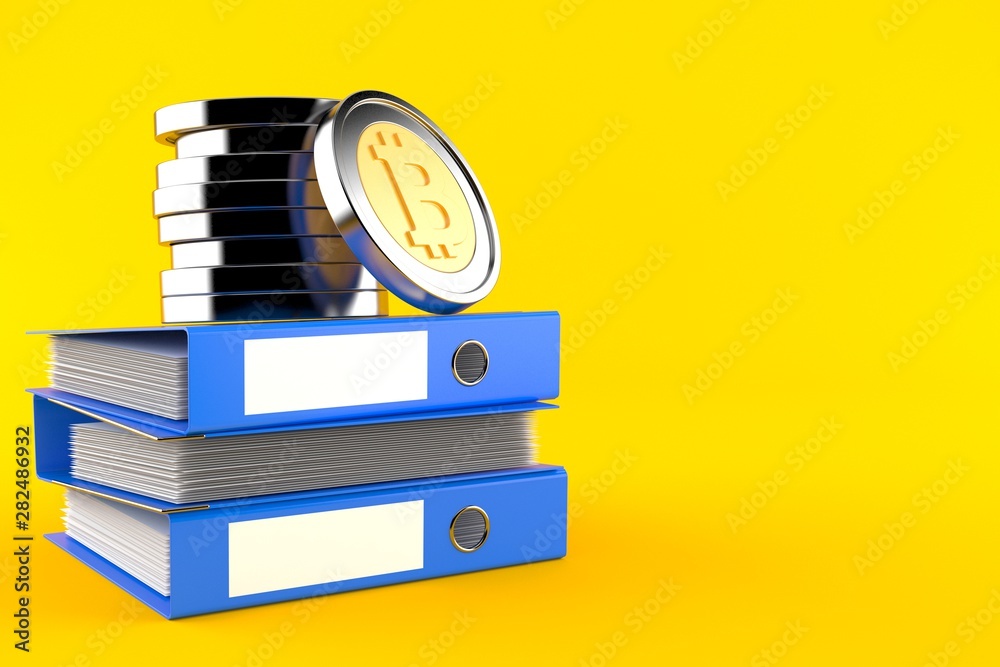 Sticker bitcoins on stack of ring binders